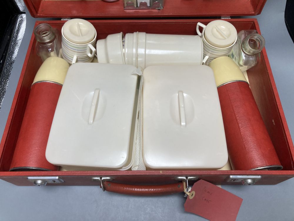 A 1960s Sirram picnic hamper set, in red vinyl case